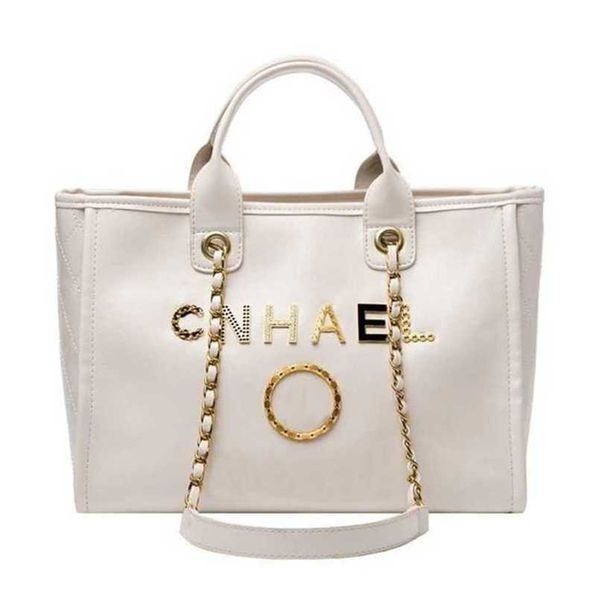 

classic women's luxury handbags beach bags metal badge tote bag designer small evening handbag female capacity large leather one should