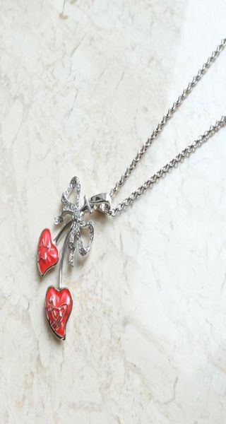 

silver full diamond bow double peach heart saturn necklace07421651