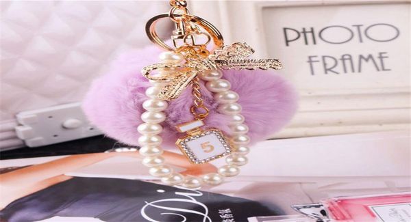 

2020 fashion pearl chain crystal bottle bow pompom keychain car women handbag key chain ring fluffy puff ball keychains jewelry1890868, Silver