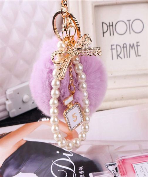 

2020 fashion pearl chain crystal bottle bow pompom keychain car women handbag key chain ring fluffy puff ball keychains jewelry8527743, Silver