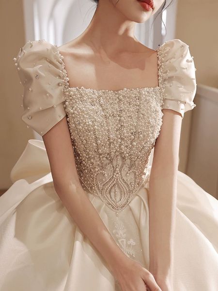 

arabic dubai women' wedding dress 2023 square neck short sleeves pearls big bow satin puffy princess bridal gown vestidos de novia hot, White