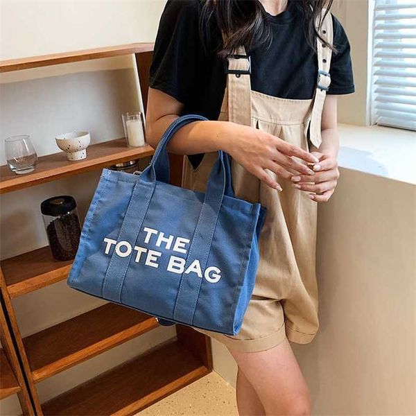

designer bag 2023 hand korean version large capacity printed letter portable tote new trend versatile shoulder casual crossbody women's