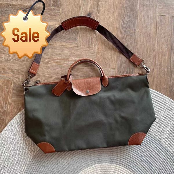 

high version cowhide with encrypted nylon large dumpling bag for men and women's travel capacity hand luggage