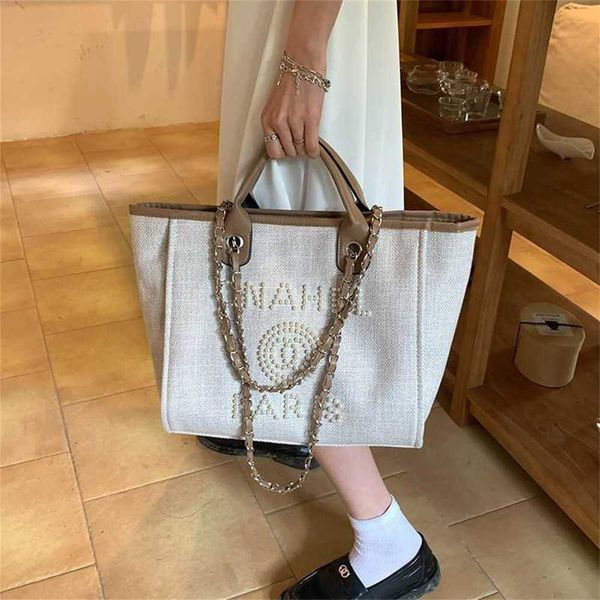 

spring and summer bags for women 2023 new pearl small commuter handheld tote bag large capacity fashion one shoulder women's bag 50% ou