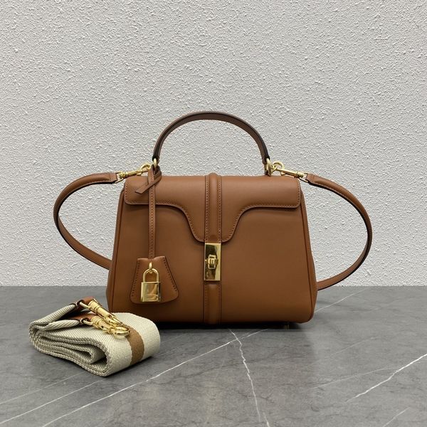 

this handbag features several classic handbag design elements from the brand's history, such as a cut edge flip with a 1960s style
