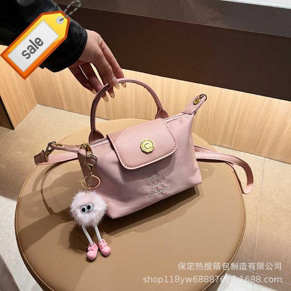 

women's designer bags 2023 summer new fashionable contrast color dragon xiang bag crossbody simple and mini handheld dumpling factory d