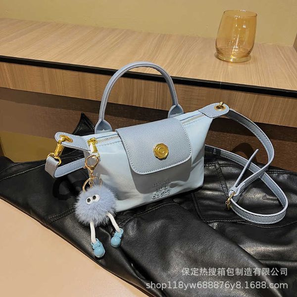 

women's designer bags 2023 summer new fashionable contrast color dragon xiang bag crossbody simple and mini handheld dumpling factory d