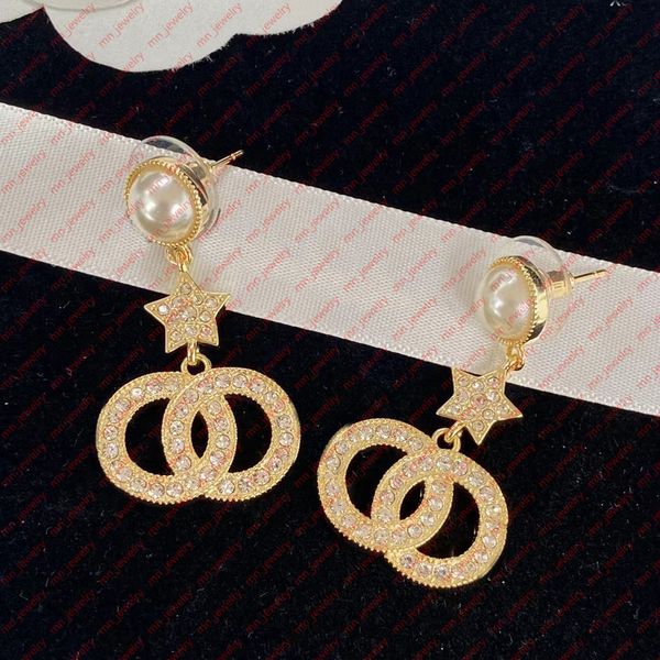 

women's luxury earrings in gold brass. pearl rhinestones, trendy and elegant designer earrings for women. wedding bridal gift designer, Golden