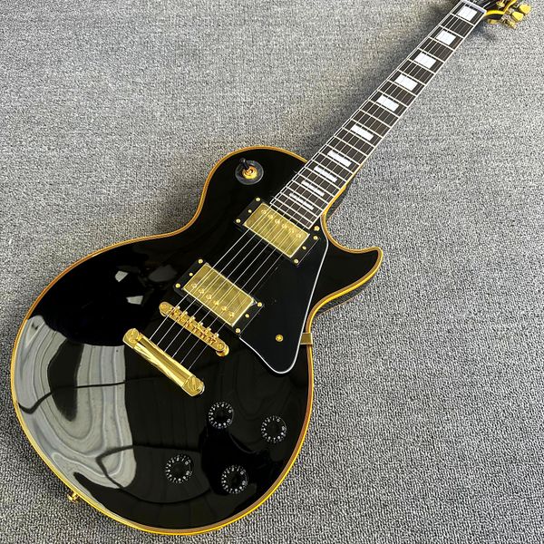 

custom shop, caton black and yellow label yellow dew electric guitar, rosewood fingerboard, yellow hardware, ing