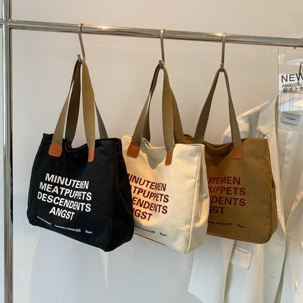 

2023 new korean edition simple canvas shoulder bag for men and women leisure simple handheld diagonal straddle bag large capacity shopping b