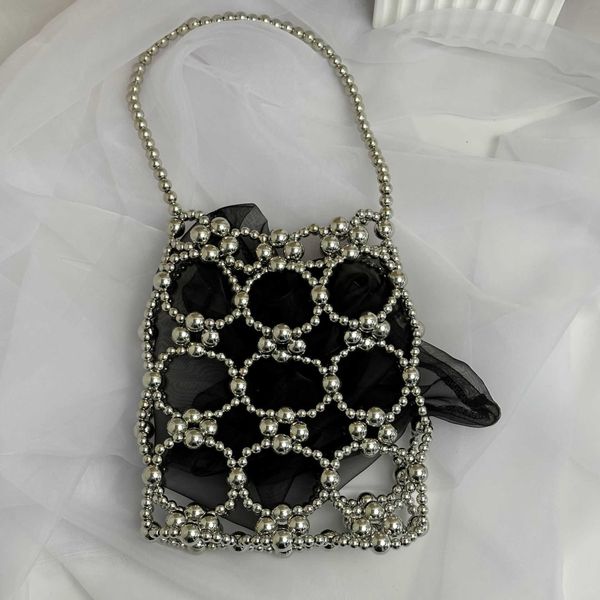 

2023 spring/summer new hollow out pearl handheld women's bag diy handmade beaded handheld bag small mini phone bag 230625