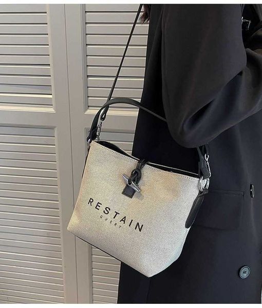 

women's designer bags 23 new french dragon bamboo canvas bucket bag female cowhide hand-held single shoulder diagonal span south style