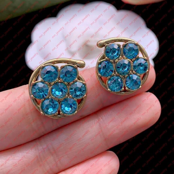 

sapphire three-dimensional flower stud earrings. sophisticated statement designer earrings for women. wedding bridal gifts designer jewelry., Golden;silver