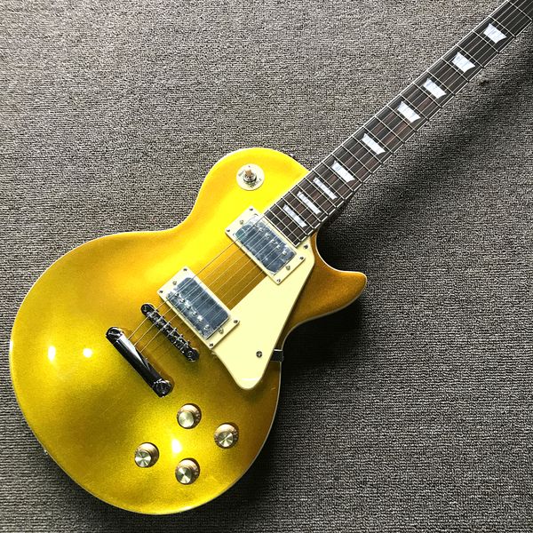 

custom shop, dan dan gold pink electric guitar, red behind, rosewood fingerboard, chrome hardware, ing
