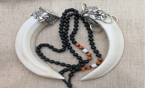 

natural wild boar tooth pendant inlaid with silver accessories animal teeth pendant personal hand piece to ward off evil spirits4330458