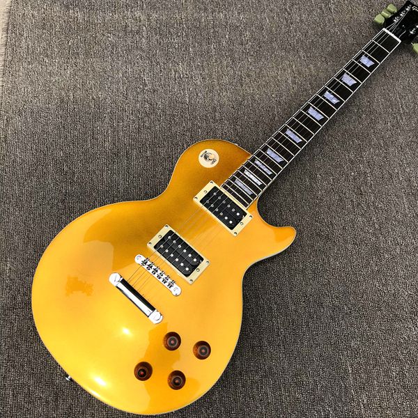 

custom shop, stendyne gold powder behind brown electric guitar, rosewood fingerboard, chrome hardware, ing