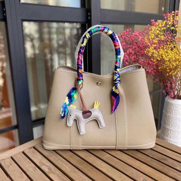 

factory wholesale designer h ormes totes handbags layer togo cowhide bag 2023 new genuine leather bucket fashion portable garden women'