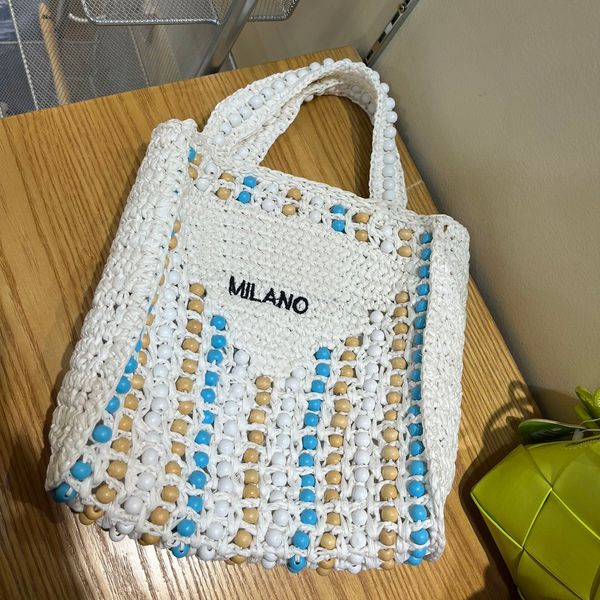

2023 new designer tote bag fashion grass round bead woven bag large travel woven handheld shopping bag beach bag