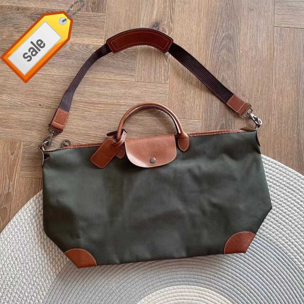 

high version cowhide with encrypted nylon large dumpling bag for men and women's travel capacity hand luggage