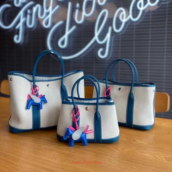 

luxury designer tote bags h home party garden online store womens bag 2023 new layer cowhide canvas garden commuting single shoulder messe w
