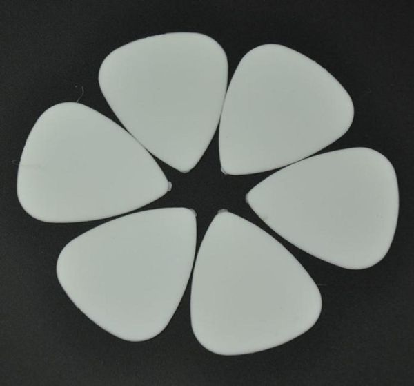 

100 pcs new medium 071mm abs guitar picks plectrums matte white5599485