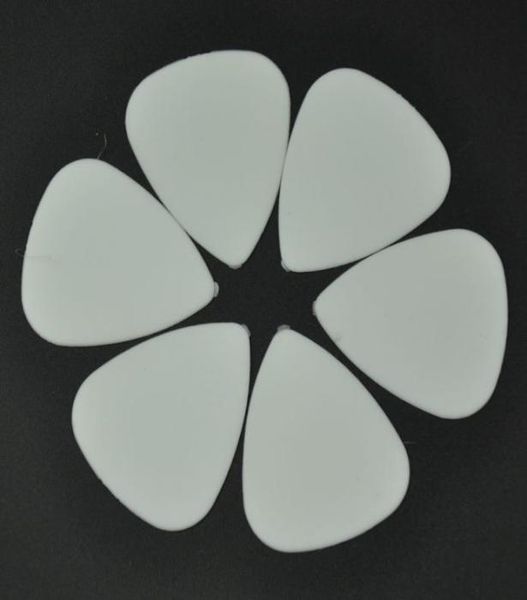 

100 pcs new medium 071mm abs guitar picks plectrums matte white1580196