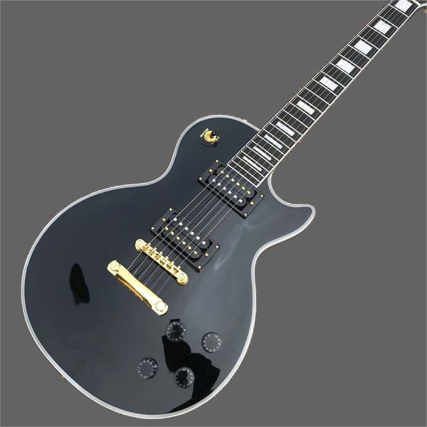 

rosewood electric guitar, black guitar, gold hardware, electric guitar