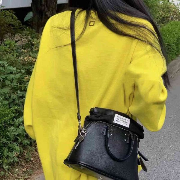 

niche design mm6 shell bag leather hand-held single shoulder messenger bag black and white classic deformation