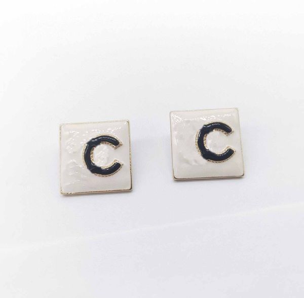 

charm square shape stud earring with black and white enamel design have box stamp ps7006a, Golden