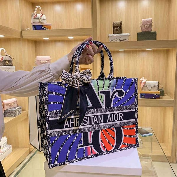 

2022 new shoulder bag fashion texture capacity canvas large new ins one shoulder tote bag commuter letter portable women's bag