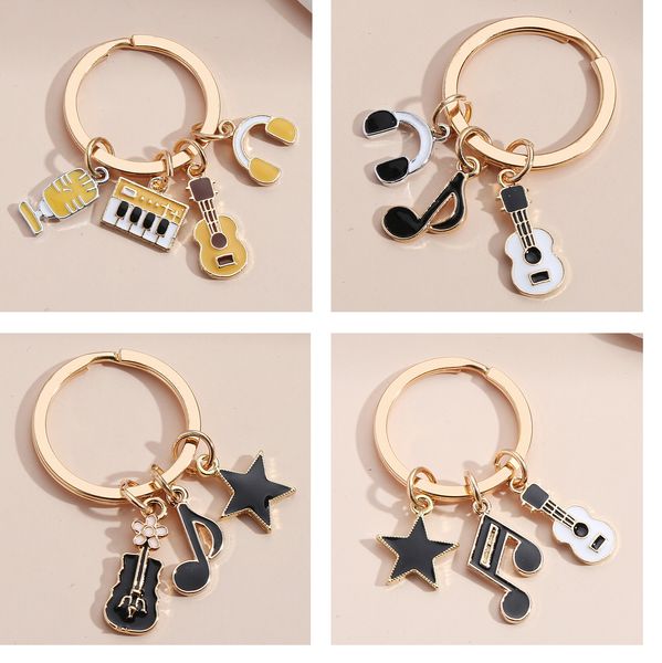 

selling key ring pentagram microphone small fragrant violin note keyboard headset keychain pendant, Silver