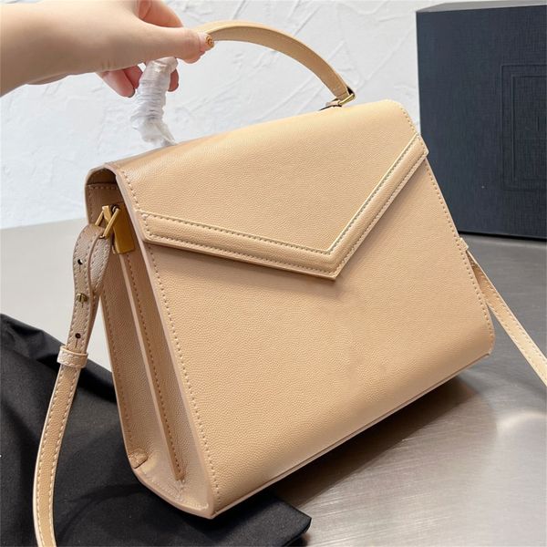 

cassandra medium handle bag in grain de poudre embossed leather designer flap pivoting closure handbag metal hardware totes luxury shoulder
