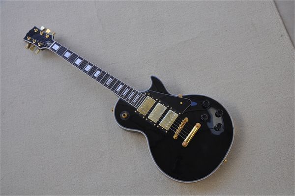 

black electric guitar mahogany body and neck rose fretboard hhh pickups white bindings fixed bridge gold tuners