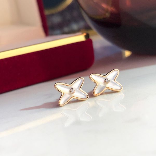 

v gold material charm stud earring in rose color and nuatre shell beads have stamp ps7254a, Golden