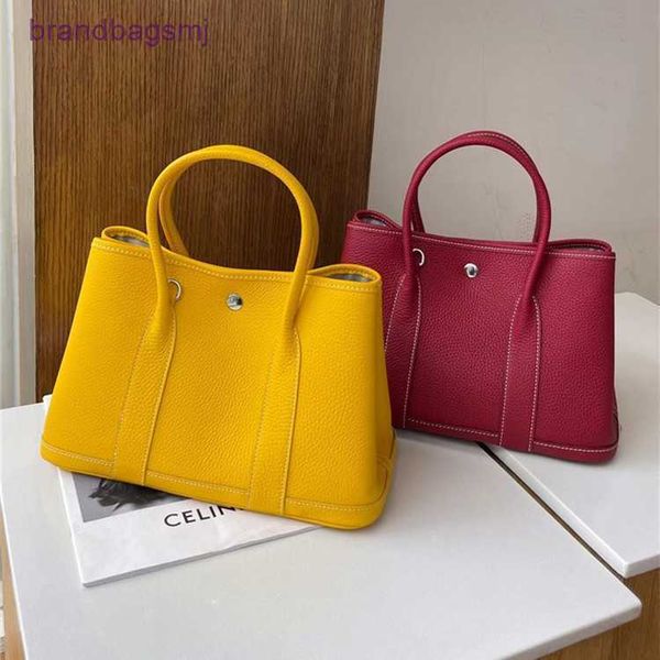 

bag herme garden baotou leather with litchi pattern and canvas shoulder strap