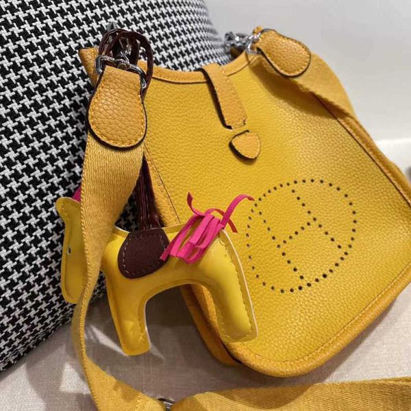 

designer bags evelyn herme womens bucket single shoulder oblique span bag head leather 2022 new hollow versatile