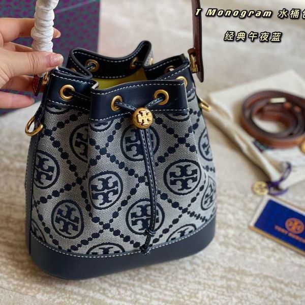 

designer torysburchs bags tb spring and summer 2022 new women's canvas flower print drawstring contrast bucket single shoulder crossbod