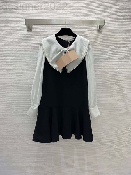 

casual dresses designer 22. the dress has a sweet temperament. bow doll neck is decorated with studs and beads. color contrast stitching a-s, Black;gray