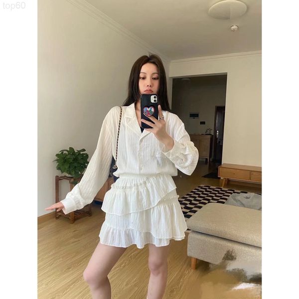

women's tracksuits designer 22ss fashionable lapel shirt semi skirt is irregular layered shorts inner lining u9lp, Gray