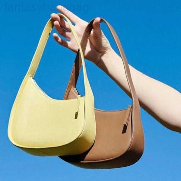 

the row bag designer bags leather half moon bag smooth designer flat shoulder strap and curved zipper closure clutch suded lining tote bag f