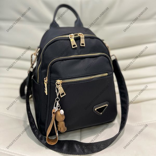 

womens canvas backpack shoulde bags diagonal crossbody bag luxury designer handbags for women card holder triangular enamel badge 30cm
