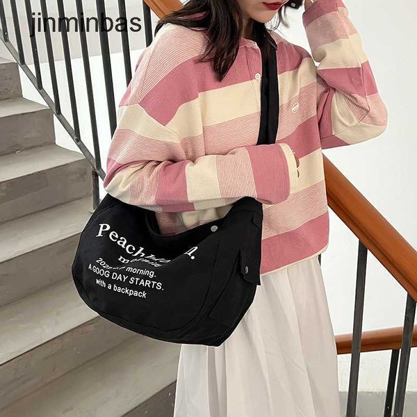 

2023 new hand bag factory 80% wholesale and retail student canvas women's shoulder new american large capacity crossbody handheld tote