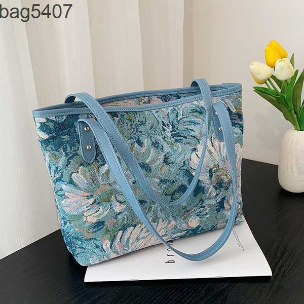

factory 50% fashion bags wholesale and retail stylish high-capacity women's new version foreign style graffiti flower bucket tote