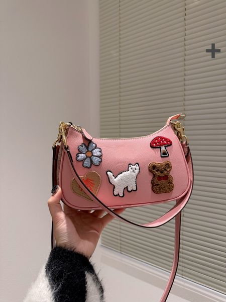 

the pink classic armpit messenger bag has a unique appearance