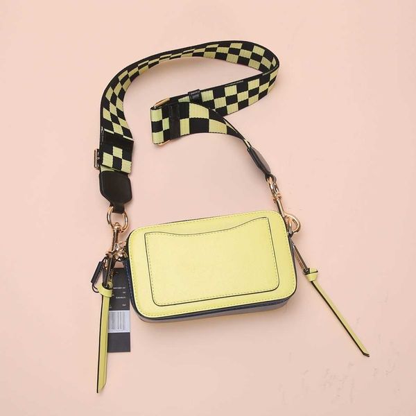 

woman's fashion handbag designer marc's jacob bags star camera bag of same model yellow material color contrast wide shoulder stra