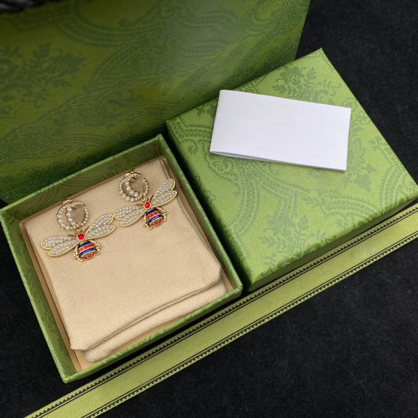 

stylish two-letter bee pearl studded vintage stud earrings with box, Golden