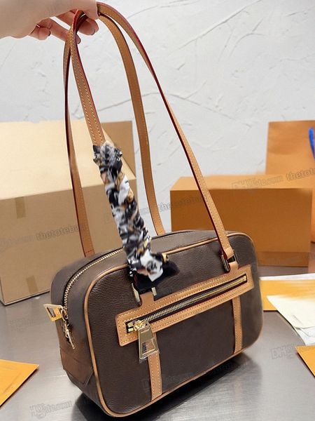 

rectangular cite bag coated canvas two long handles shoulder bags gold-color hardware inside front flat pocket double zip closure designer l