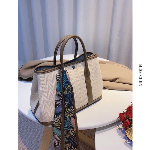 

aher max designer fashion head layer leather herme garden bag misschen "meet the garden" canvas with hand
