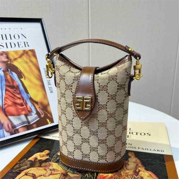 

2022 new jacquard embroidered cotton linen bucket bag high-grade french fries hand-held diagonal cross mobile phone women's bag