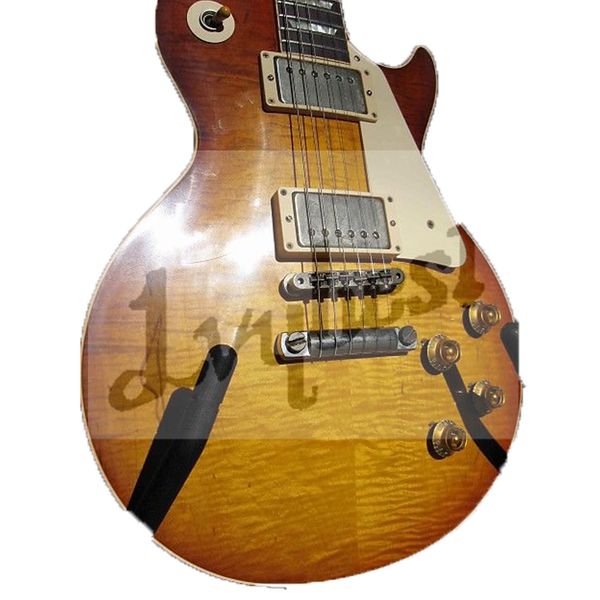 

electric guitar with flame relic finished and old aged parts small pin bridge.cherry burst